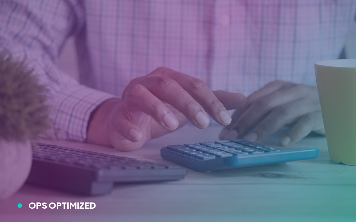 A founder working through numbers on a calculator at their desk